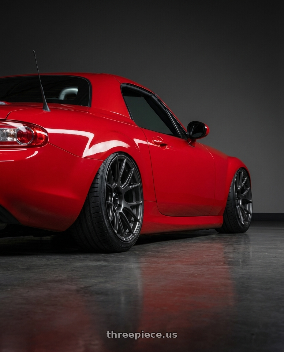 2012 Mazda MX-5 Miata NC with Konig Ampliform 5x114.3 17x8+40 Dark Metallic Graphite wheels rear three quarter view slight stretch tires