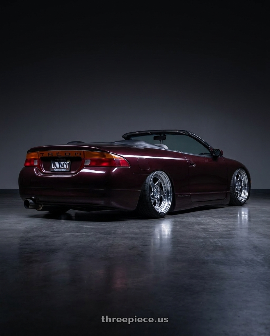 1995 eagle talon with Heritage Wheel AVUS wheels rear three quarter view extreme stretch tires