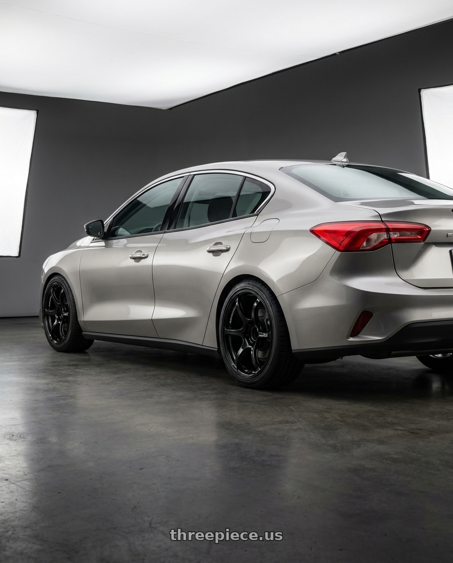 2019 Ford Focus Mk4 4D with Advan RGIII 4x100 18x7.0+42 Gloss Black wheels rear three quarter view square tires
