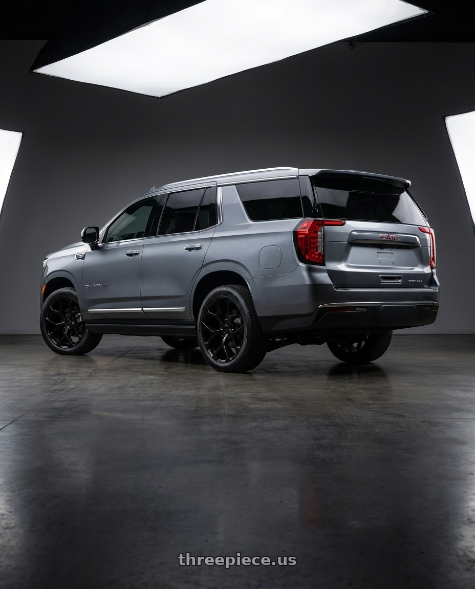 2021 GMC Yukon Denali with REPLICA 348 6X139.7 22x9.5 +30 FULL BLACK wheels rear three quarter view square tires