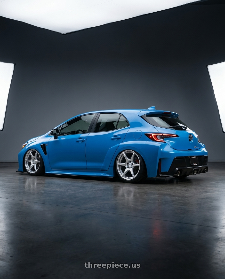 2024 Toyota GR Corolla with Kansei K11S Tandem 5x114.3 18x10.5 12 Hyper Silver wheels rear three quarter view slight stretch tires