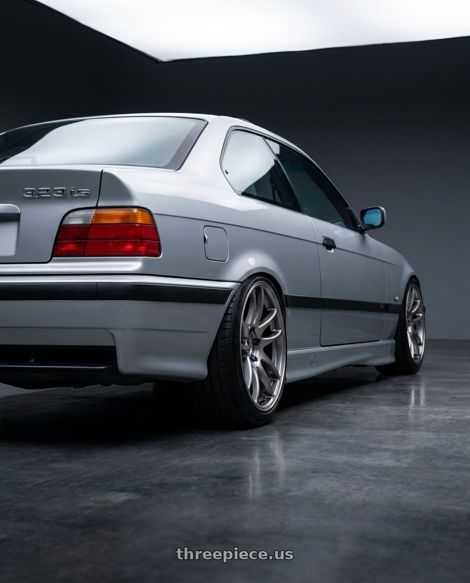 1999 BMW 323is with Work Emotion Cr Kiwami 5x120 17x8 +35 Gt Silver wheels rear three quarter view square tires