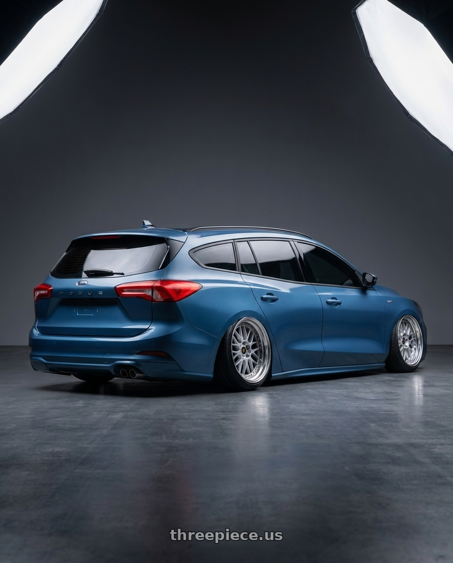 2023 focus wagon  with Work Vs-Xx 5x100 18x7+51 A Disk Light Grey Silver wheels rear three quarter view extreme stretch tires