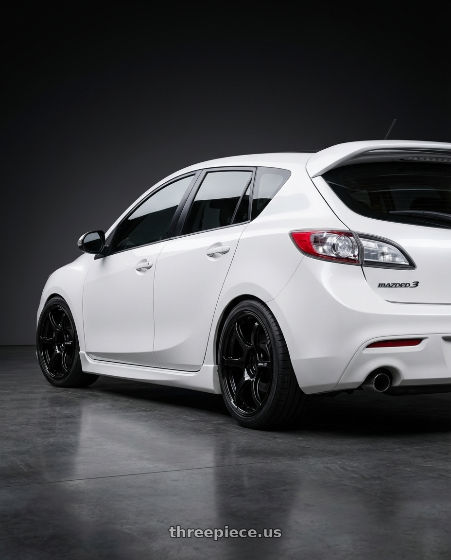 2012 Mazda Mazdaspeed3 with Advan RGIII 5x114.3 18x10+35 Gloss Black wheels rear three quarter view square tires