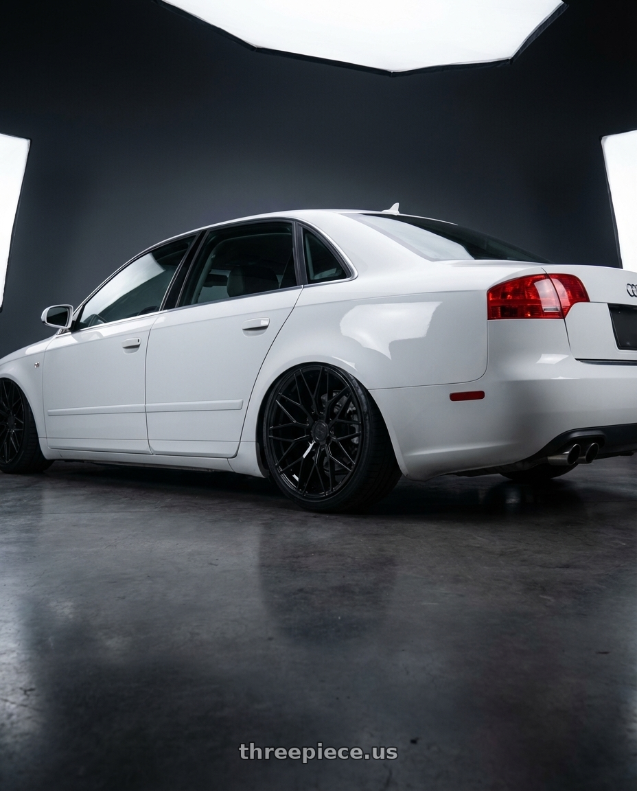 2010 Audi A4 B7 with Avant Garde Wheels M520R 5X112 19x9.5 +40 Gloss Black wheels rear three quarter view slight stretch tires