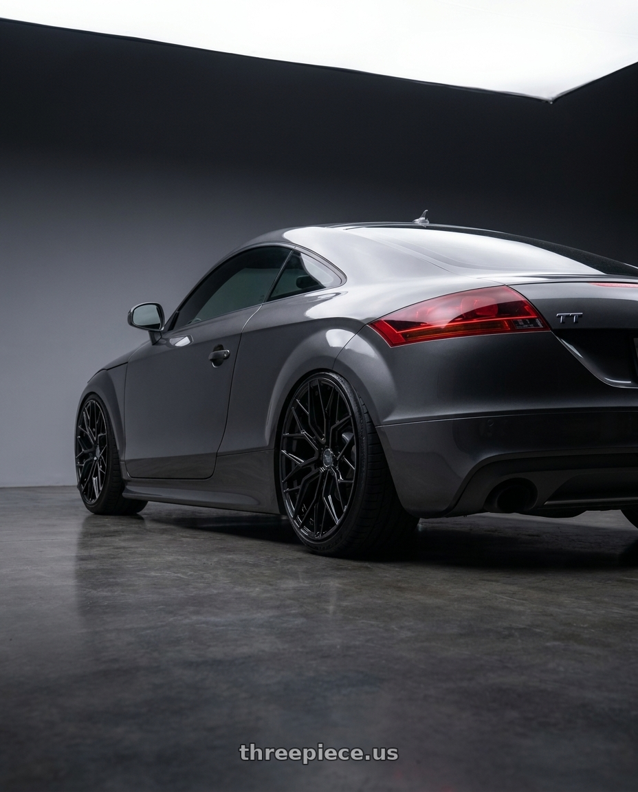 2012 Audi Tt with F1R FS3 5x112 18x8.5 +42 Gloss Black wheels rear three quarter view extreme stretch tires