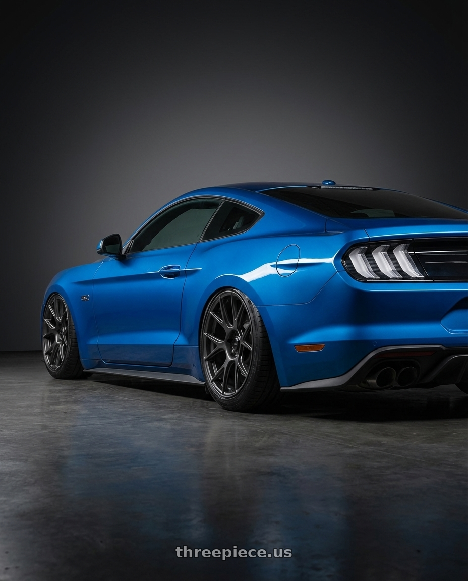 2022 Ford Mustang GT with Konig Ampliform 5x114.3 20x9.5+25 Dark Metallic Graphite wheels rear three quarter view slight stretch tires