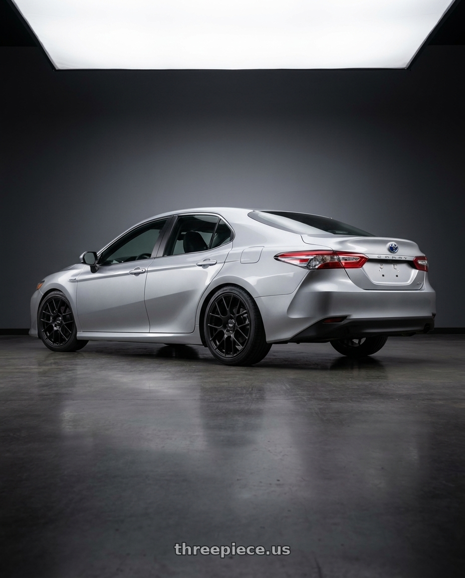 2021 Toyota Camry Hybrid LE with Enkei Raijin 5x114.3 19x8.5+35 Black wheels rear three quarter view square tires
