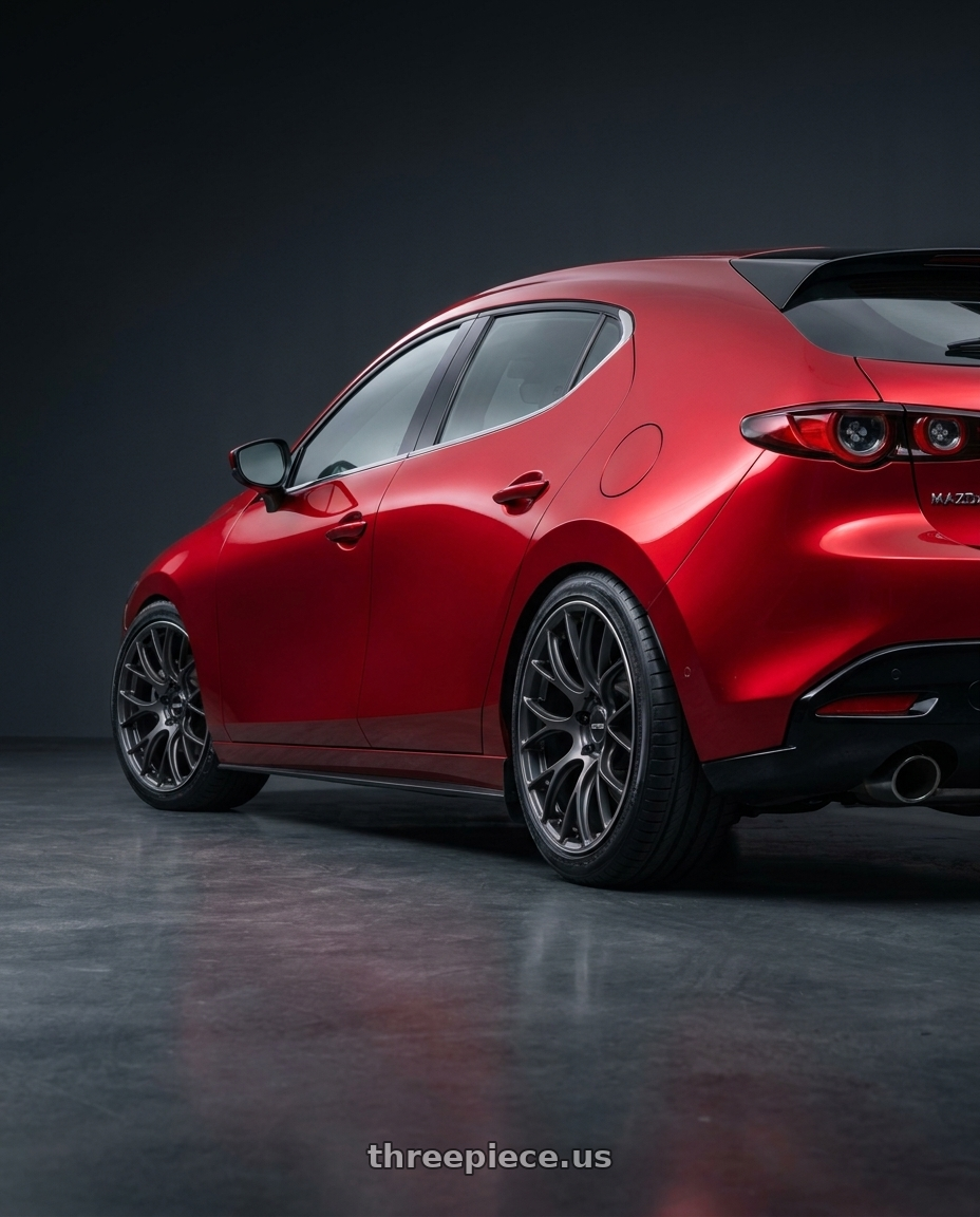 2024 Mazda 3 with Volk Racing G16 5x120 19x9.0+23 wheels rear three quarter view slight stretch tires