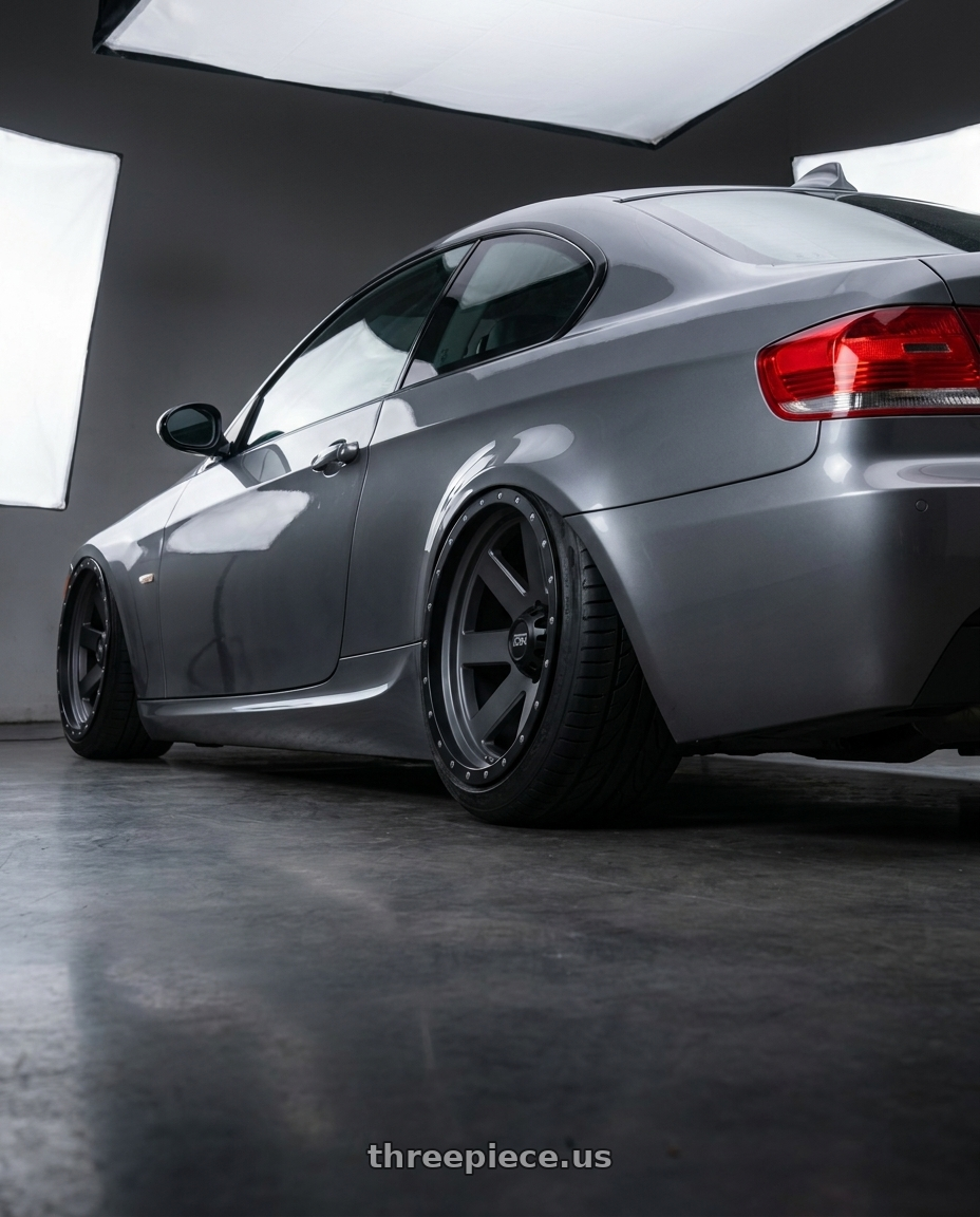 2009 e92 335i m sport highline coupe, space grey with Ion Type 134 5x127 20x10-19 Matte Gunmetal/Black Beadlock wheels rear three quarter view meaty tires