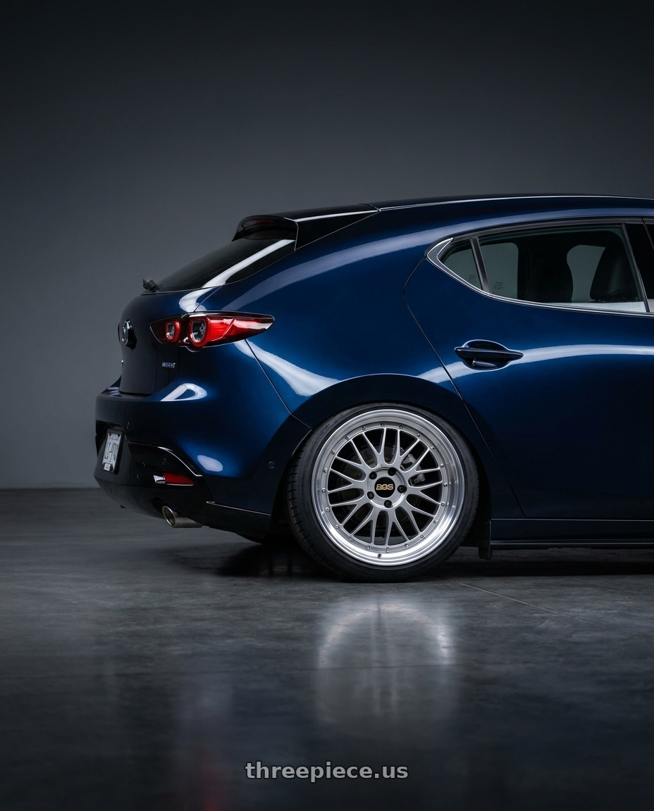 2025 Mazda 3 Deep Mica with BBS LM 5x114.3 18x8.5+38 Diamond Silver wheels rear three quarter view square tires
