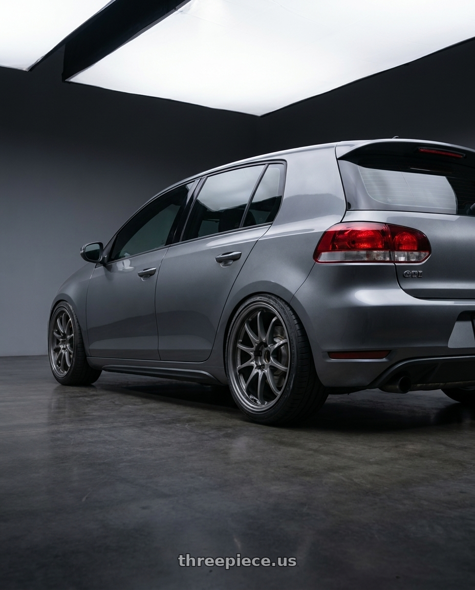 2012 vw gti with Volk Racing CE28N-PLUS M-SPEC 5x112 18x9 +38 BLAST GUNMETAL wheels rear three quarter view slight stretch tires