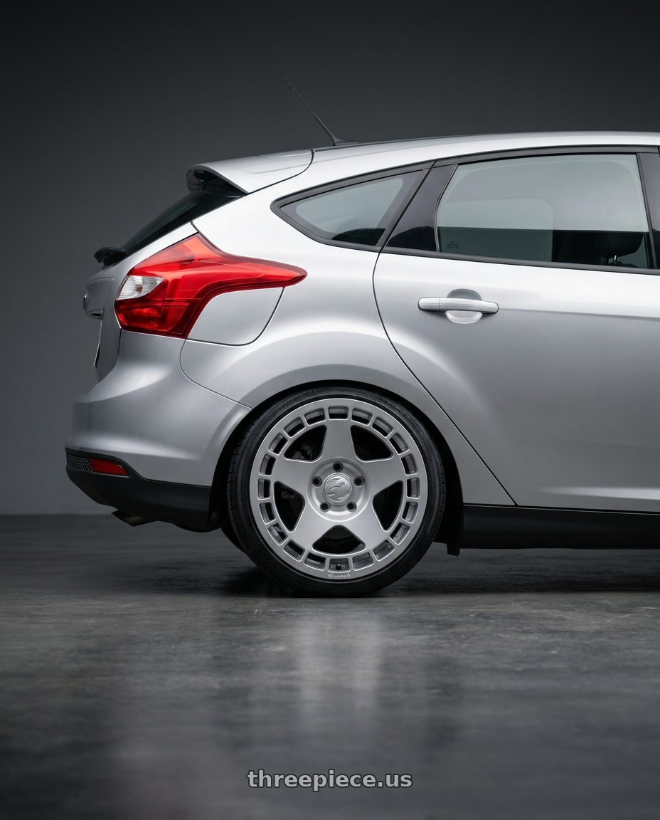 2014 ford focus mk3 1.6 silver with fifteen52 TURBOMAC 5x108 18x8.5 +42 SPEED SILVER (GLOSS SILVER) wheels rear three quarter view slight stretch tires