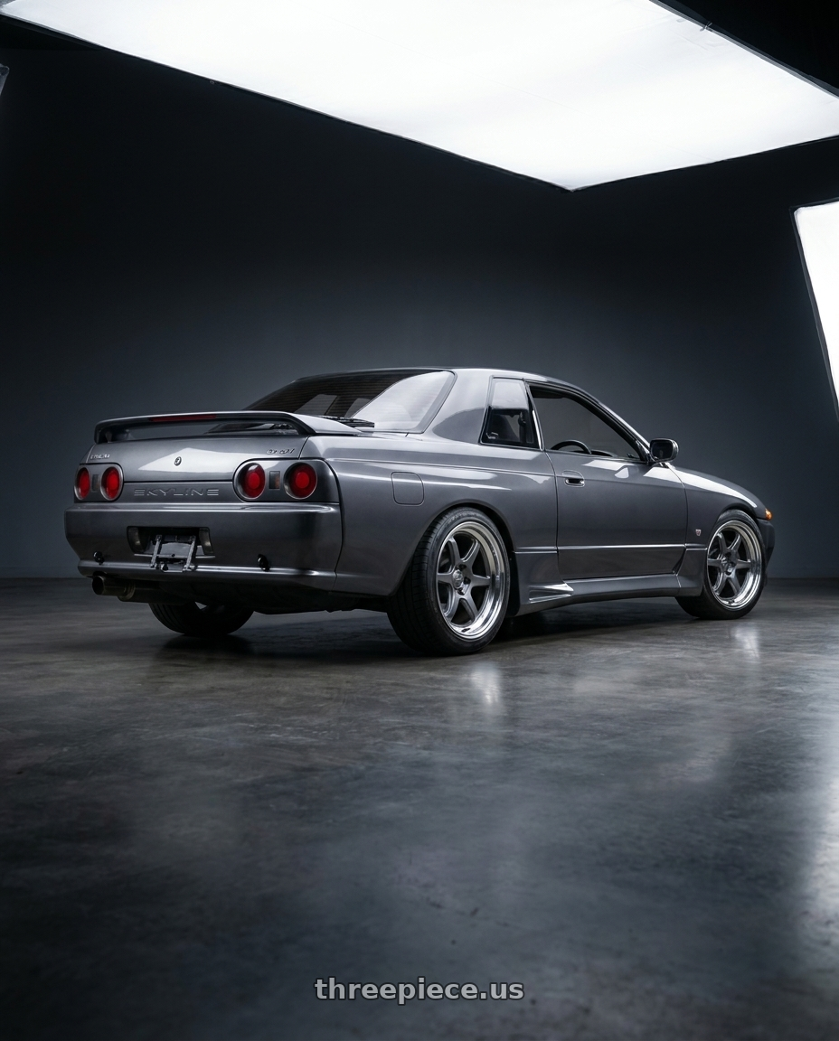 1992 Nissan Skyline R32 GTS-T Type M with Kansei K14G Roku 5x114.3 18x9.5 22 Grey and Machined Lip wheels rear three quarter view square tires
