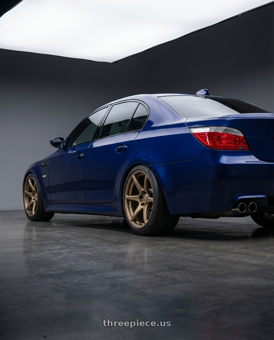 2010 BMW M5 E60 with Kansei K11B Tandem 5X120 19x10.5 22 Bronze wheels rear three quarter view square tires