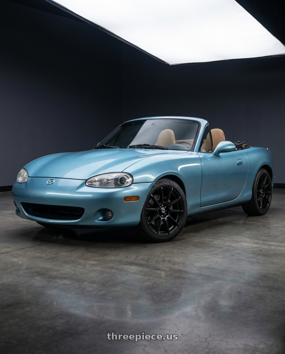 2002 Mazda Miata with Konig 45B Control 4x100 / 4x108 14x6 +40 Black wheels