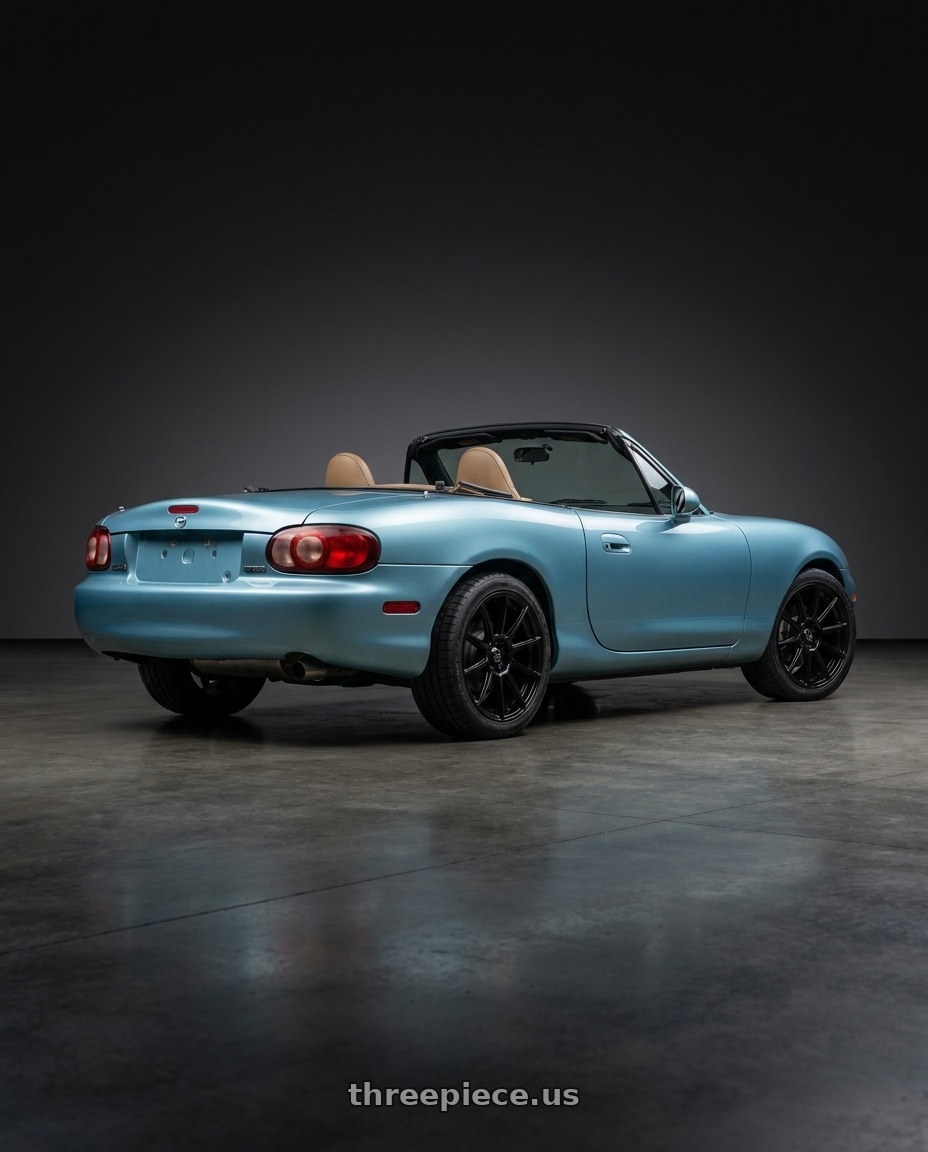 2002 Mazda Miata with Konig 45B Control 4x100 / 4x108 14x6 +40 Black wheels rear three quarter view square tires
