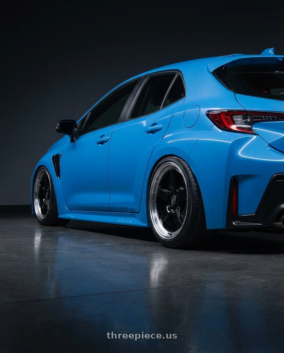 2024 Toyota GR Corolla with Forgestar D5 Drag 5x114.3 18x10 +42 Gloss Black Machined wheels rear three quarter view slight stretch tires