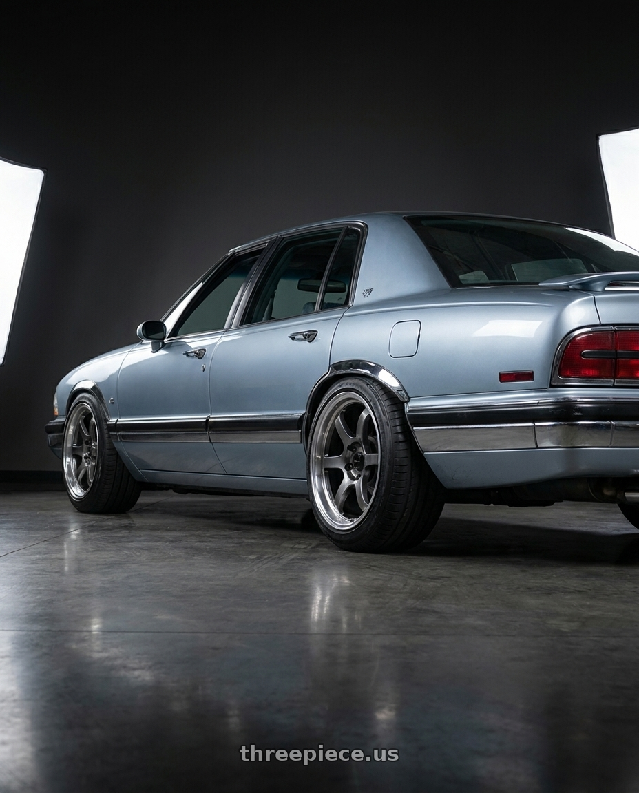 1992 Buick Park Avenue with Vors LT61 5x115 17x7.5 +35 Hyper Black wheels rear three quarter view meaty tires