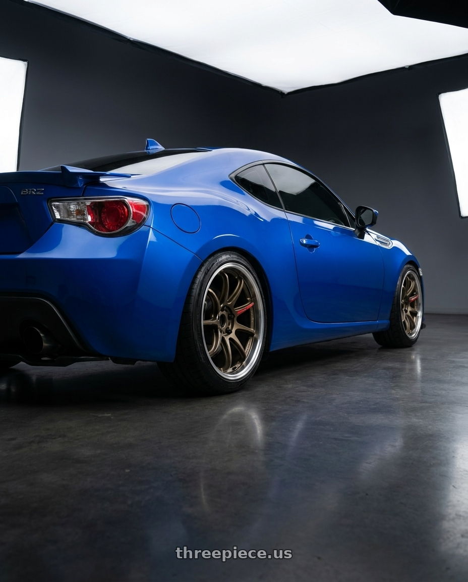 2016 Subaru Brz world rally blue with Work Zr10 2P 5x100 18x9.5 +22 Matte Bronze wheels rear three quarter view square tires