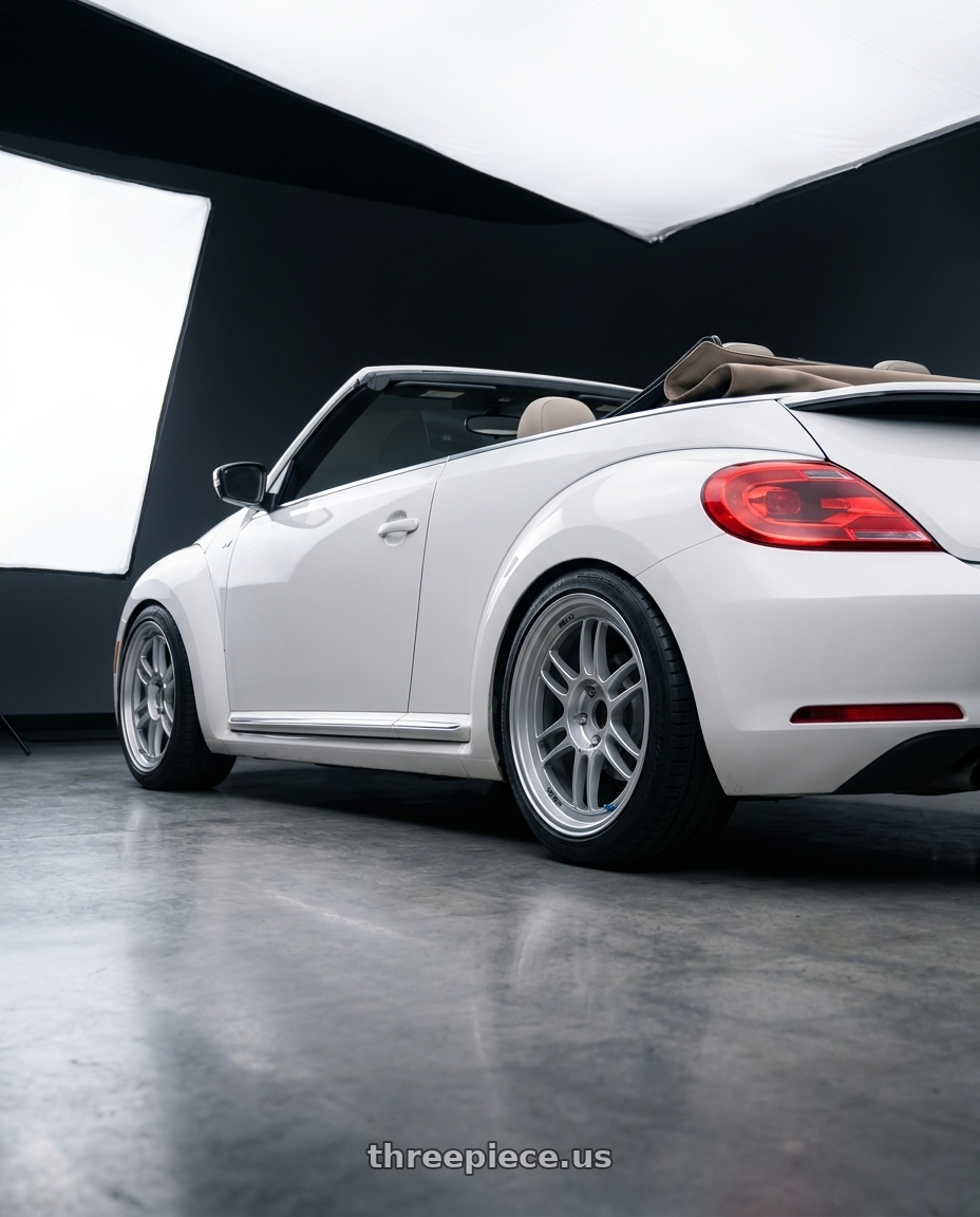 2015 Volkswagen Beetle r with Enkei RPF1RS 5x114.3 18x10.5+0 Silver wheels rear three quarter view slight stretch tires