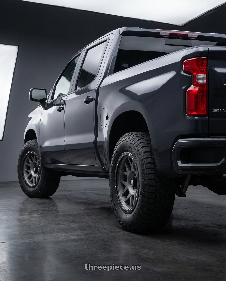 2023 Chevrolet Silverado 1500 with XD XD127 BULLY 6X139.7 20X9 +0 MATTE GRAY BLACK RING wheels rear three quarter view meaty tires