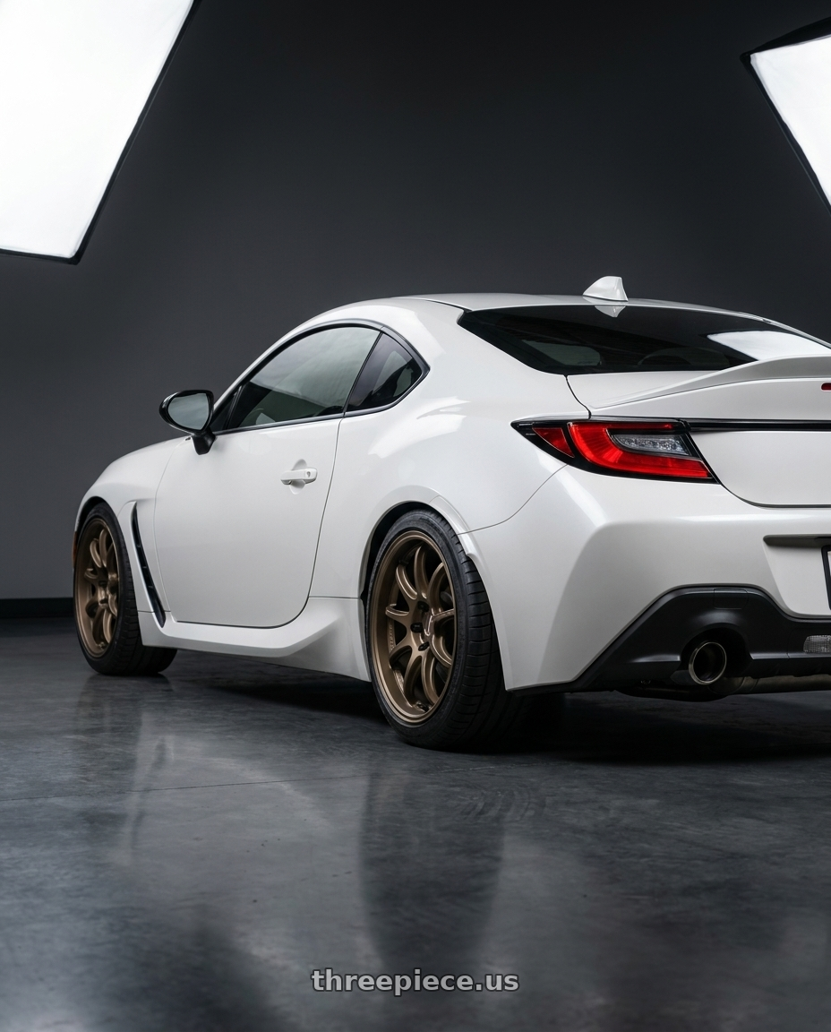 2026 Toyota gr86 with Work Emotion D9r 5x100 18x8.5 +38 Matte Bronze wheels rear three quarter view square tires