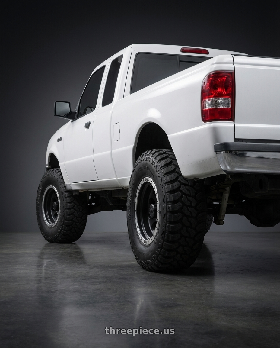 2003 Ford Ranger with Mickey Thompson Classic Baja Lock 5x114.3 15x10 -45 A192582 wheels rear three quarter view meaty tires