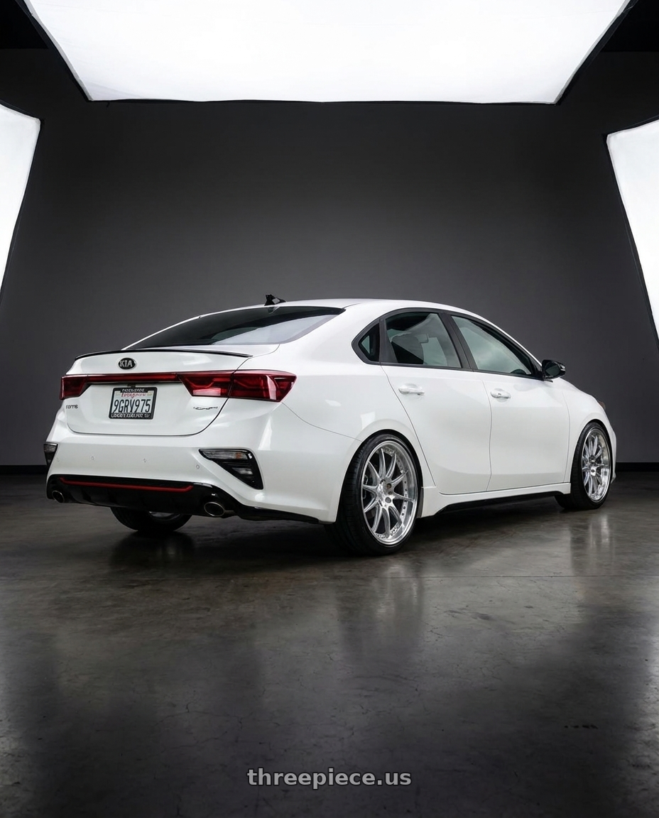 2023 kia forte with Aodhan DS07 5x114.3 18x8.5+35 Silver w/Machined Face wheels rear three quarter view slight stretch tires