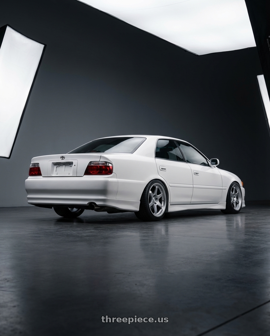 1999 Toyota Chaser Tourer GP with Kansei K15H Astro 5X120 18x9 22 Hyper Silver wheels rear three quarter view square tires