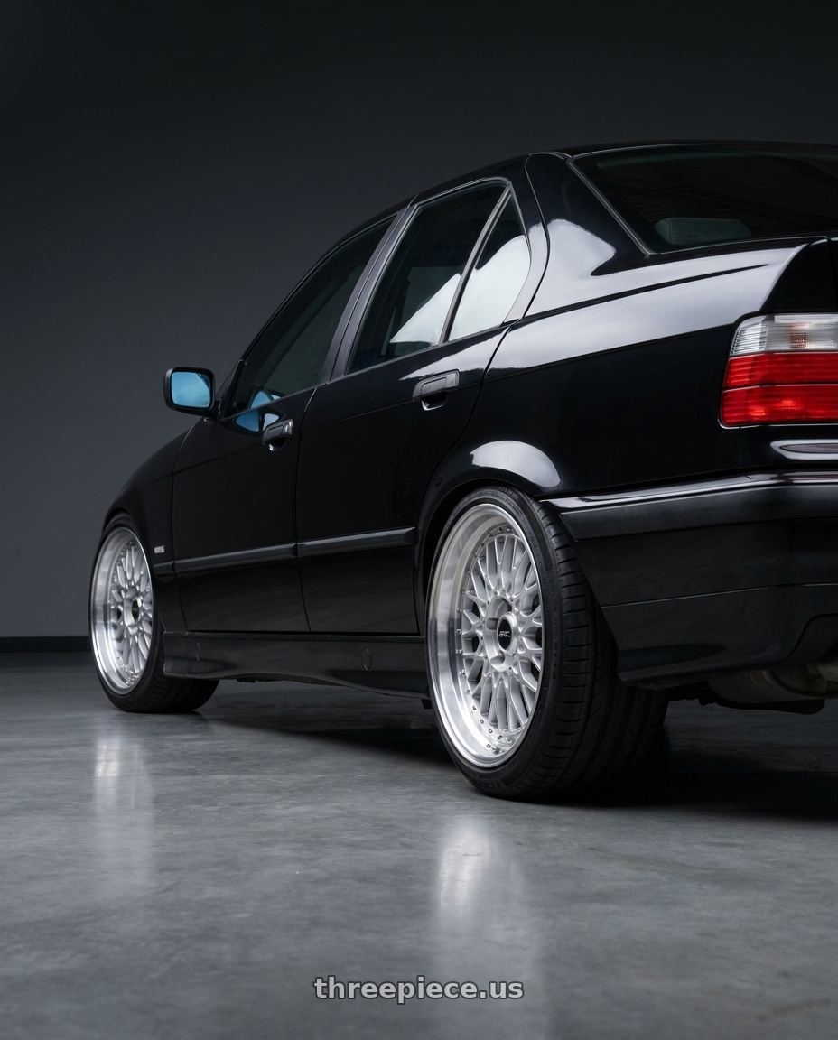1997 BMW 3 black with ARC AR1 5x120 17x8.5  +35 Silver Machine Face Lip Chrome Rivet wheels rear three quarter view square tires