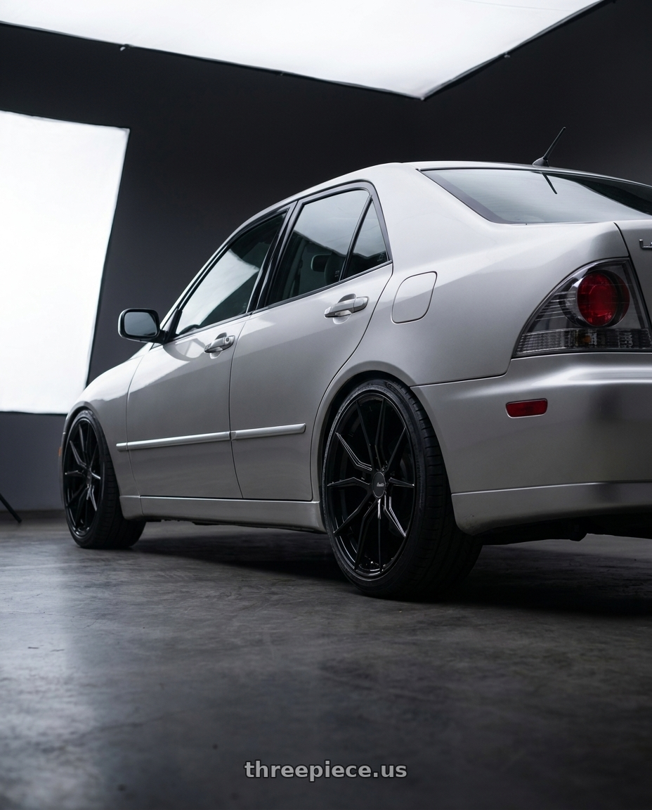 1999 Lexus Is200 with Advanti Racing 80B Hybris 5x114.3 18x8 +45 Gloss Black wheels rear three quarter view square tires