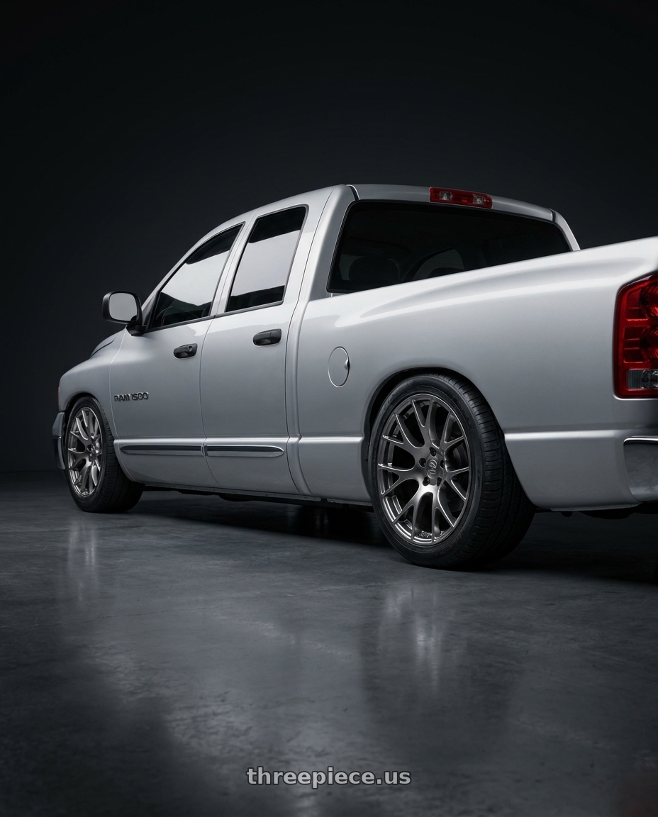 2004 dodge ram 1500 with OE Wheels DG15 5x115 20x9+18 Gloss Hyper Black wheels rear three quarter view square tires