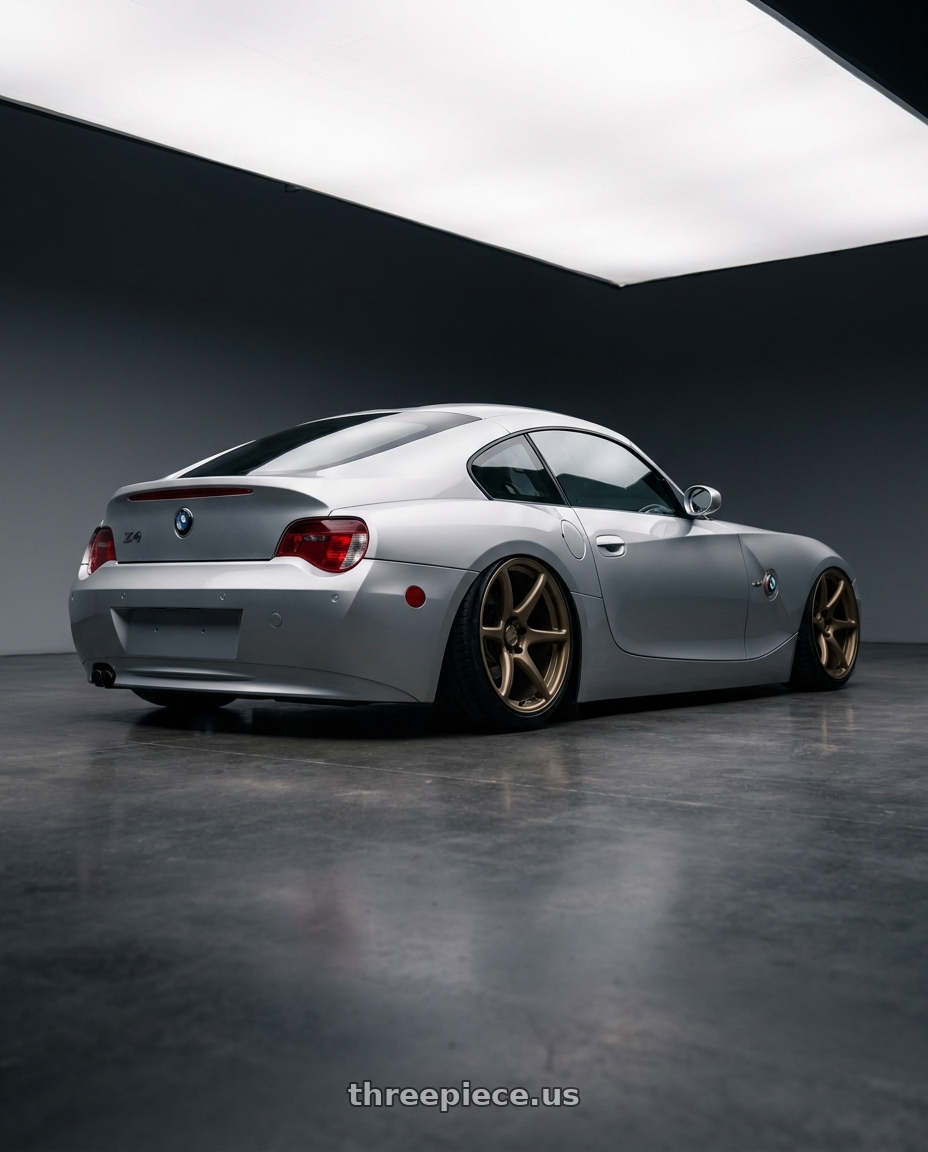 2006 E85 Z4 with Kansei K11B Tandem 5X120 19x9.5 22 Bronze wheels rear three quarter view slight stretch tires