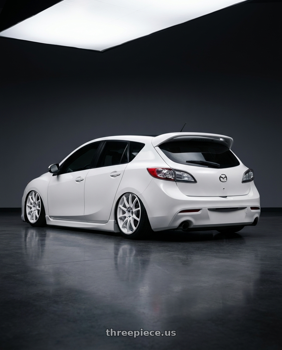2012 Mazda Mazdaspeed3 with Advan RCIII 5x114.3 18x8.5+38 White wheels rear three quarter view slight stretch tires