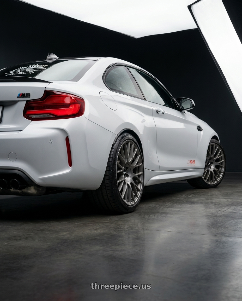 2020 Bmw m2 with Rotiform 795 5x114.3 22x9 +38 MATTE ANTHRACITE wheels rear three quarter view square tires