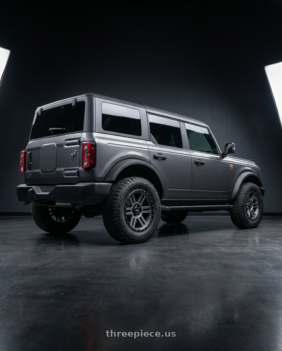 2023 Ford Bronco Badlands with Vision Off-Road 354 Manx 2 6x139.7 17x9+12 Satin Grey wheels rear three quarter view square tires