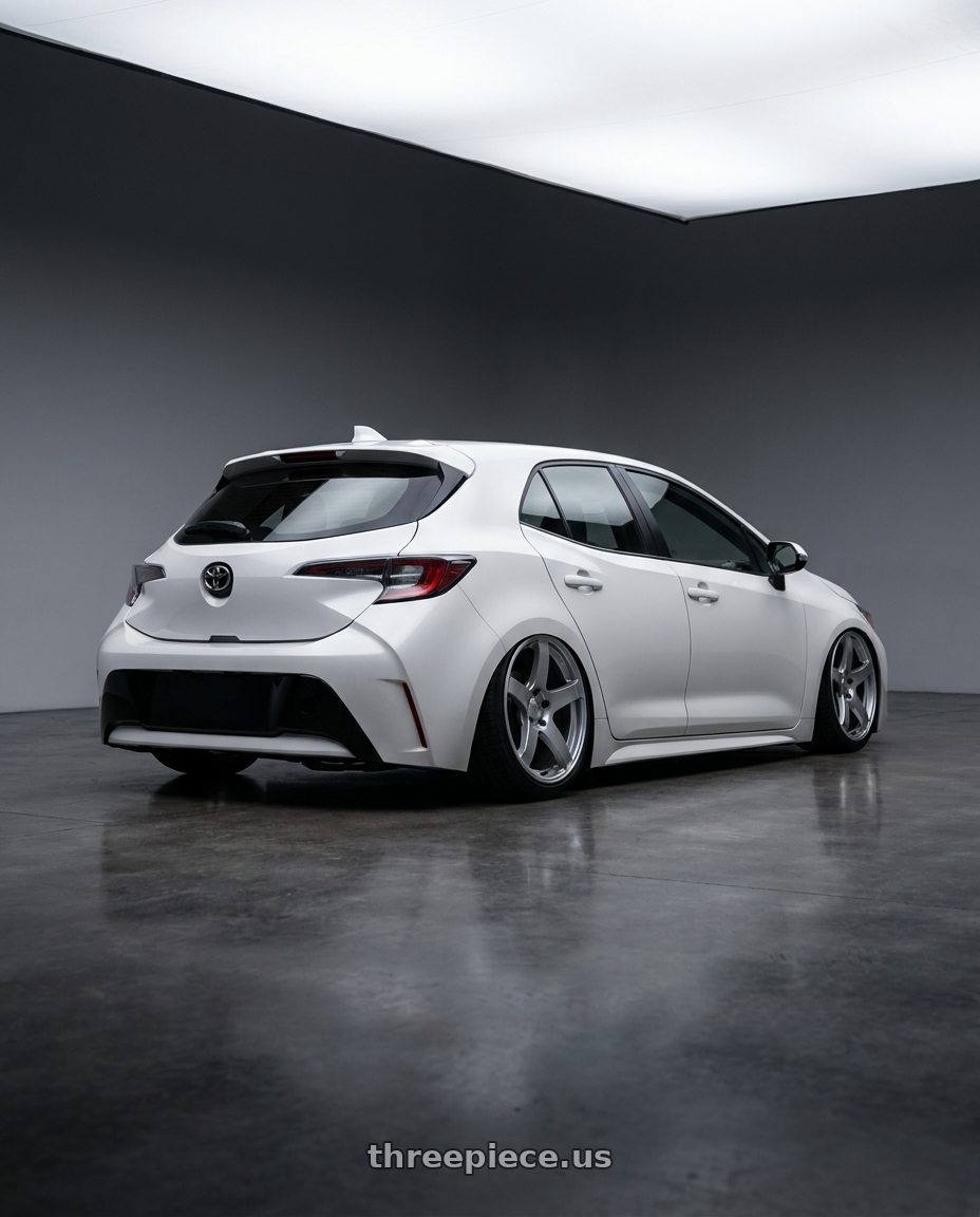 2023 Toyota Corolla Hatchback with Ssr Gtv01 5x114.3 18x8+35  GLARE SILVER wheels rear three quarter view slight stretch tires