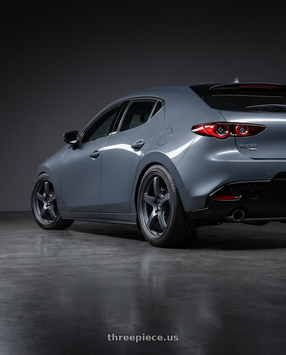 2023 Mazda Mazda3 Turbo with Gram Lights 57CR 5x114.3 18x10.5+12 Gunblue II wheels rear three quarter view square tires