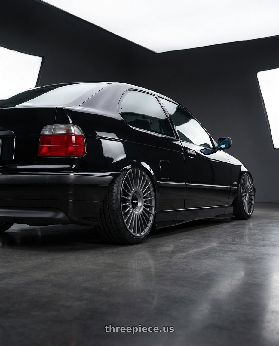 1998 bmw 318ti base black with Rotiform RC202 GRZ BLANK 18x8.5 +45 MATTE ANTHRACITE wheels rear three quarter view slight stretch tires