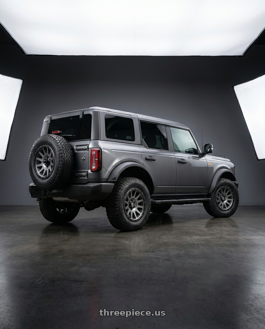 2023 Ford Bronco Badlands with Icon Alloys COMPRESSION 6x139.7 17X8.5+25 TITANIUM wheels rear three quarter view square tires