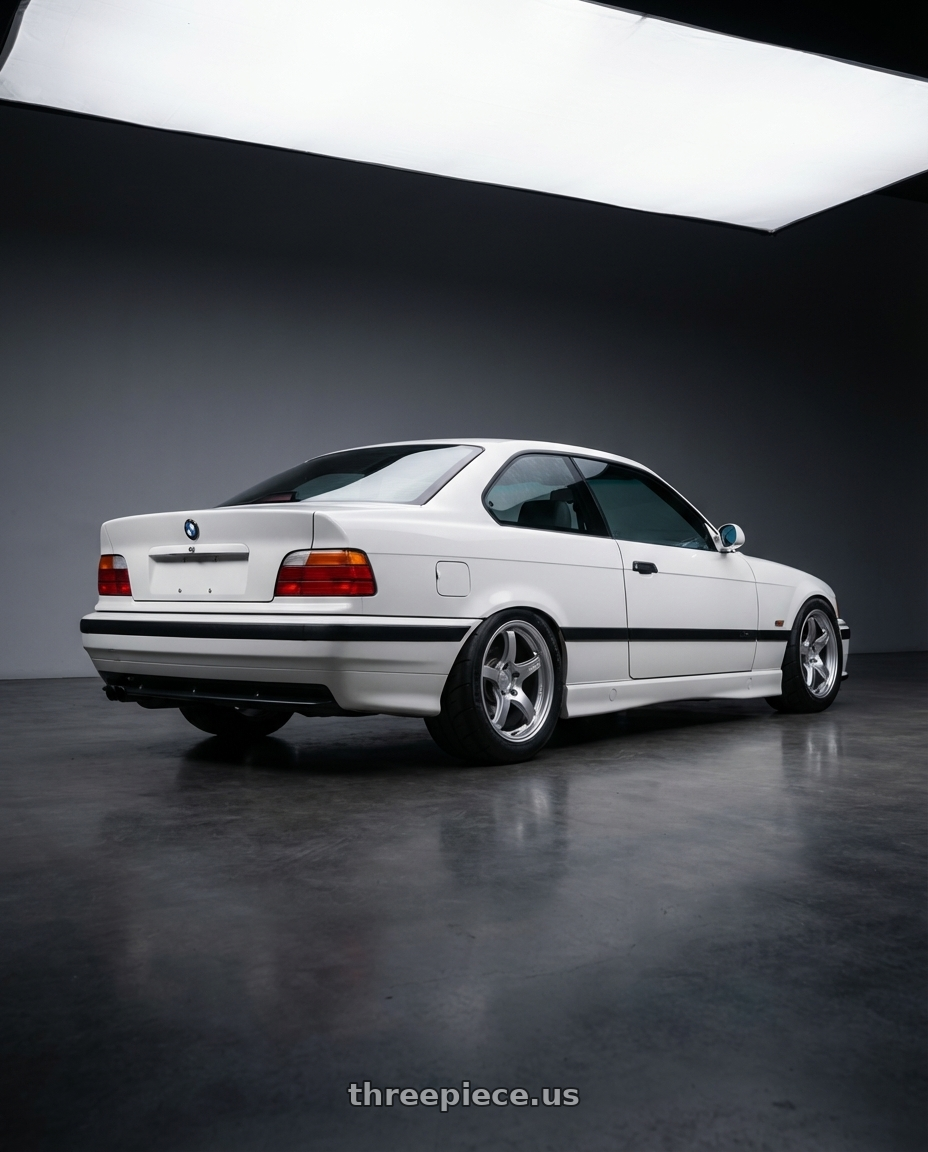1998 BMW 328IS, Alpine White with Gram Lights 57CR 5x114.3 18x9.5+38 Grace Silver wheels rear three quarter view meaty tires