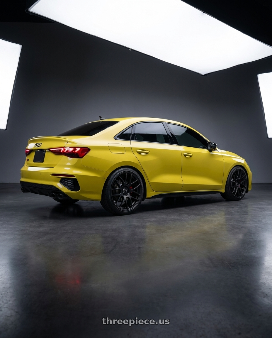 2023 Audi S3 with Work Emotion m8r 5x112 19x8.5 +45 Matte Black wheels rear three quarter view square tires