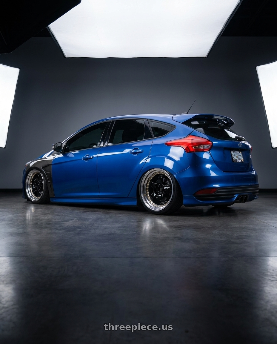 2018 Ford Focus St Blue with Work Meister S1 3P 5x100 18x9.5+29 A Disk Black wheels rear three quarter view slight stretch tires