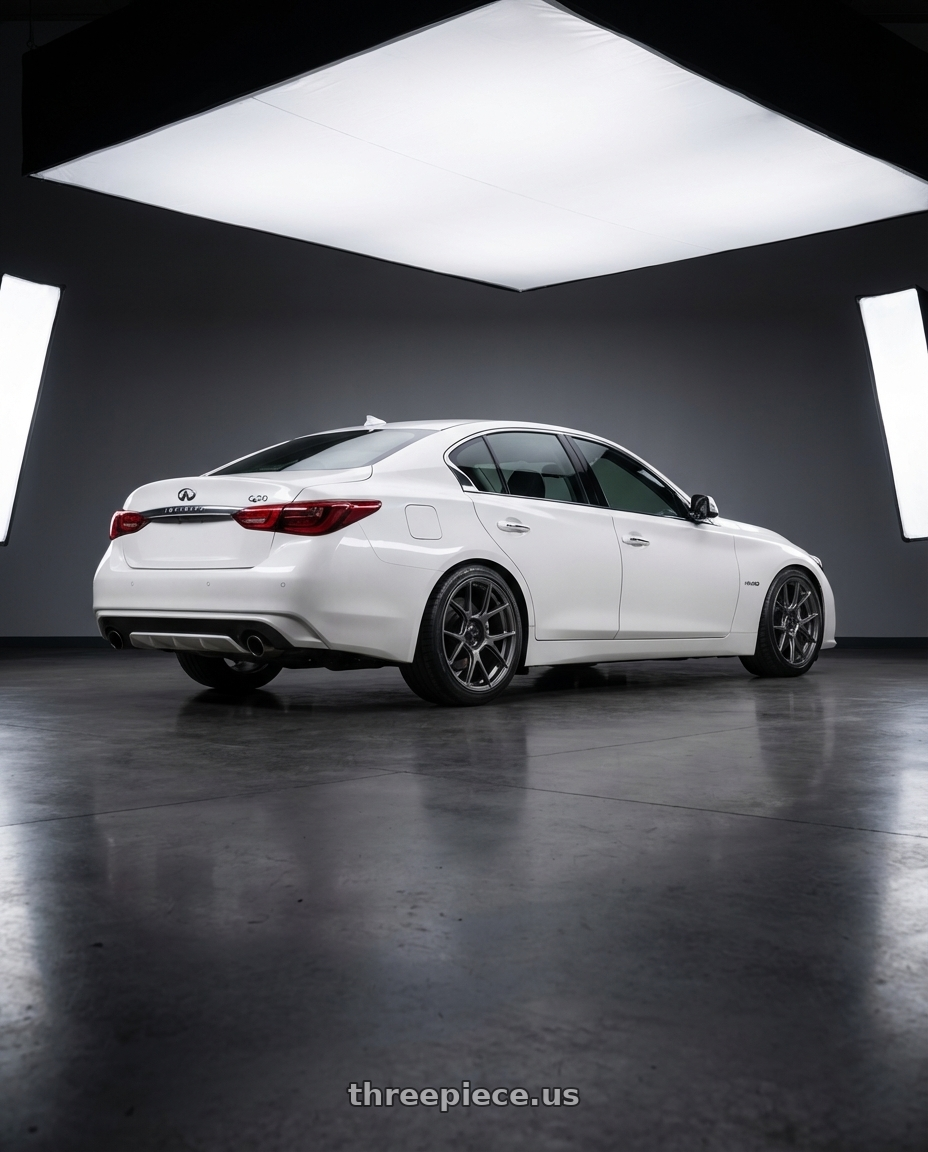 2020 Infiniti Q50 with Konig Ampliform 5x114.3 19x9.5+25 Dark Metallic Graphite wheels rear three quarter view square tires