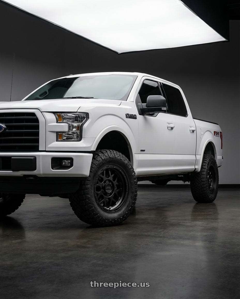 2017 ford f150 sxt with KMC KM535 GRENADE OFF-ROAD 6X139.7 17X8.5 +0 MATTE BLACK wheels front three quarter view lifted stance