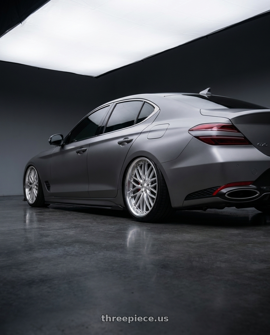 2024 genesis g70 with MRR GT1 5x114.3 20x8.5  +35 Hyper Silver Machine Lip wheels rear three quarter view slight stretch tires