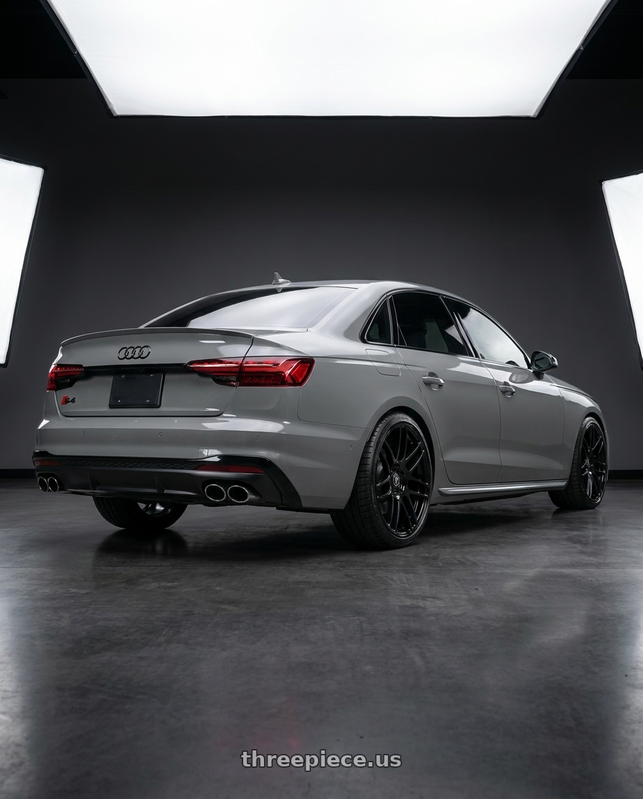 2021 Audi S4 Prestige with Forgestar F14 5x112 19x8.5 +35 Gloss Black wheels rear three quarter view square tires