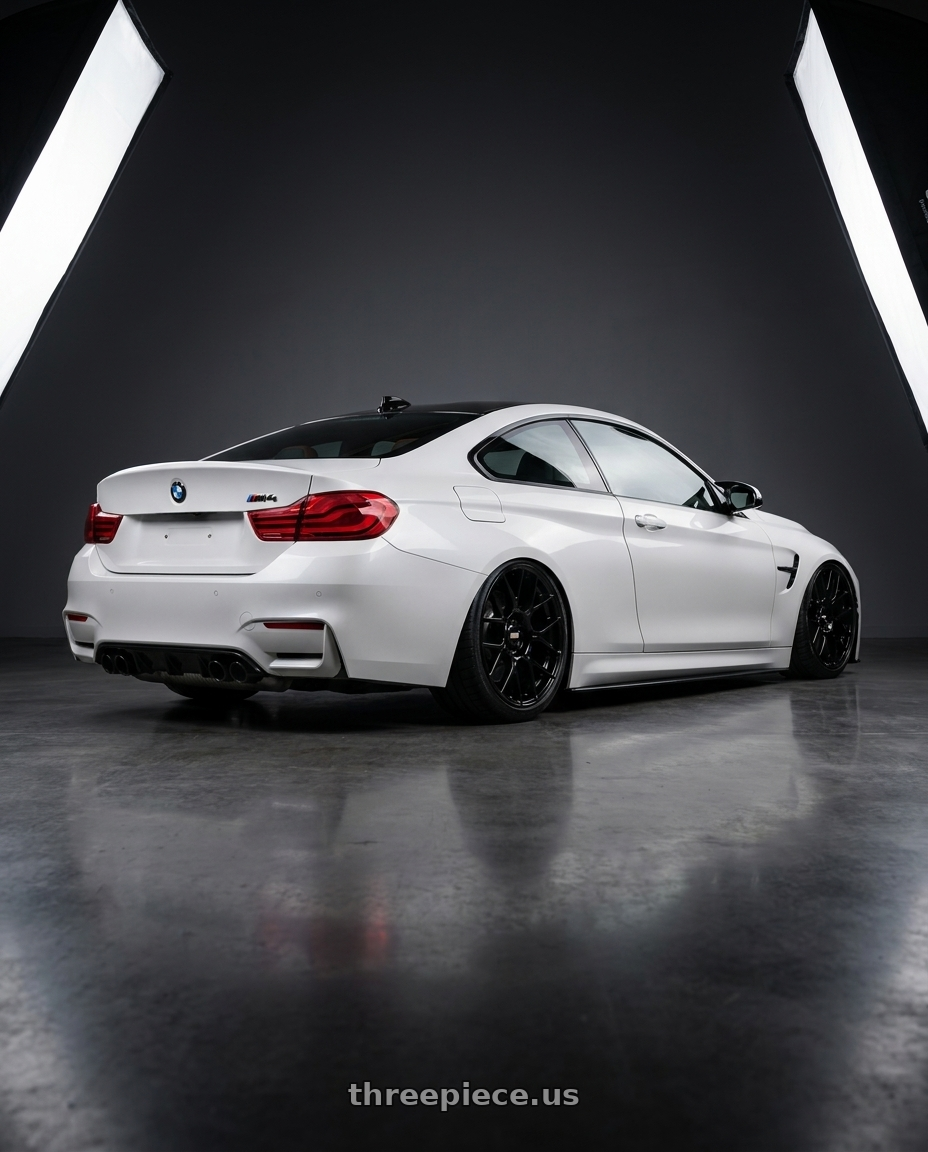 2018 BMW M4 F82 with BBS XR 5x120 19x8.5+35 Gloss Black wheels rear three quarter view slight stretch tires