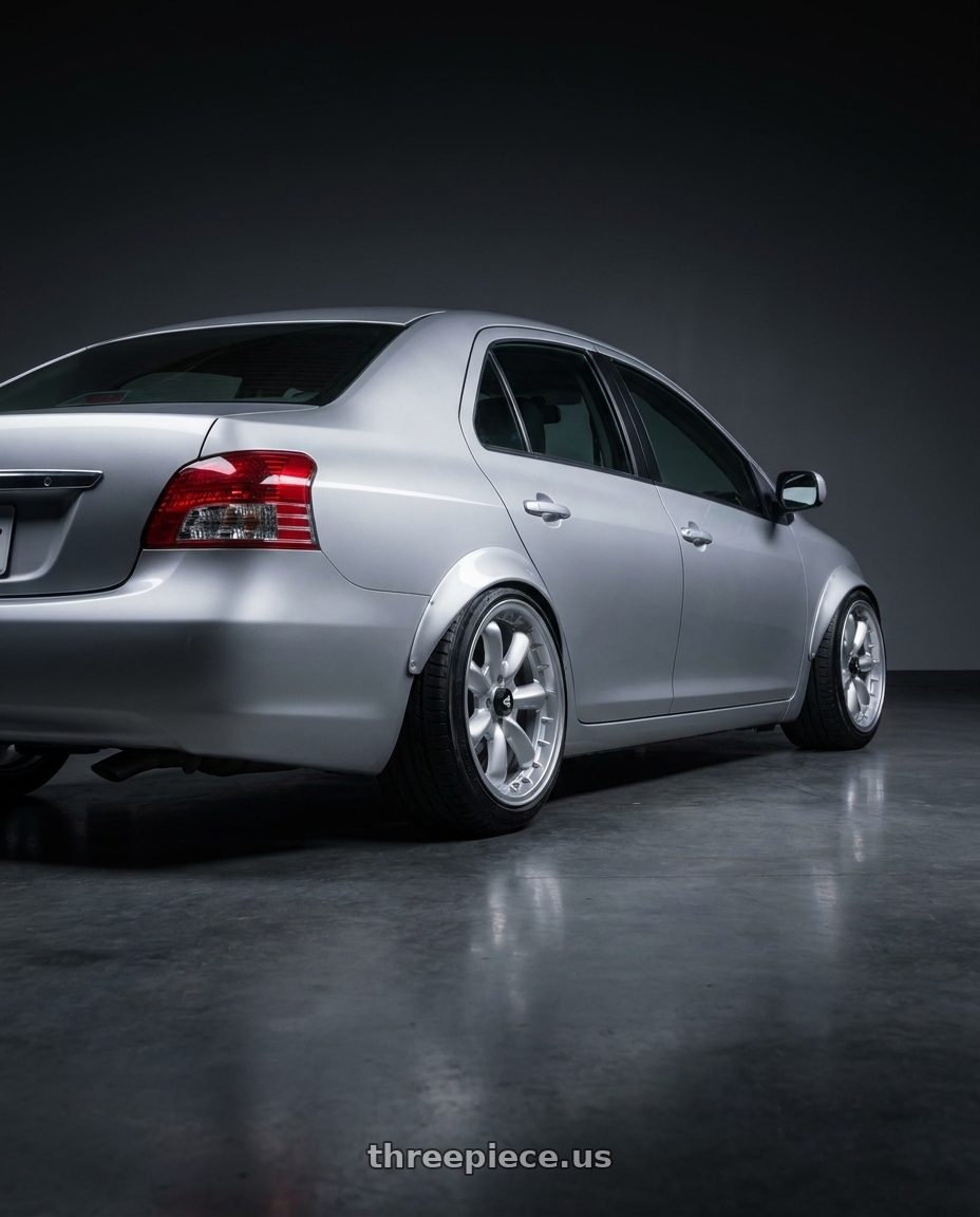 2012 Toyota vios with Enkei Compe 4x100 16x7+38 Silver wheels rear three quarter view slight stretch tires